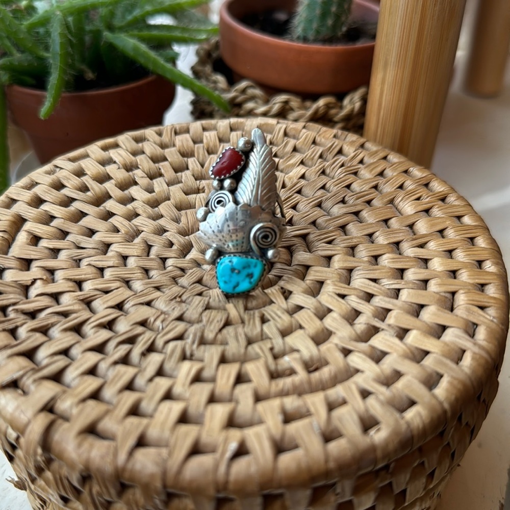 Sterling silver with turquoise and coral stones.